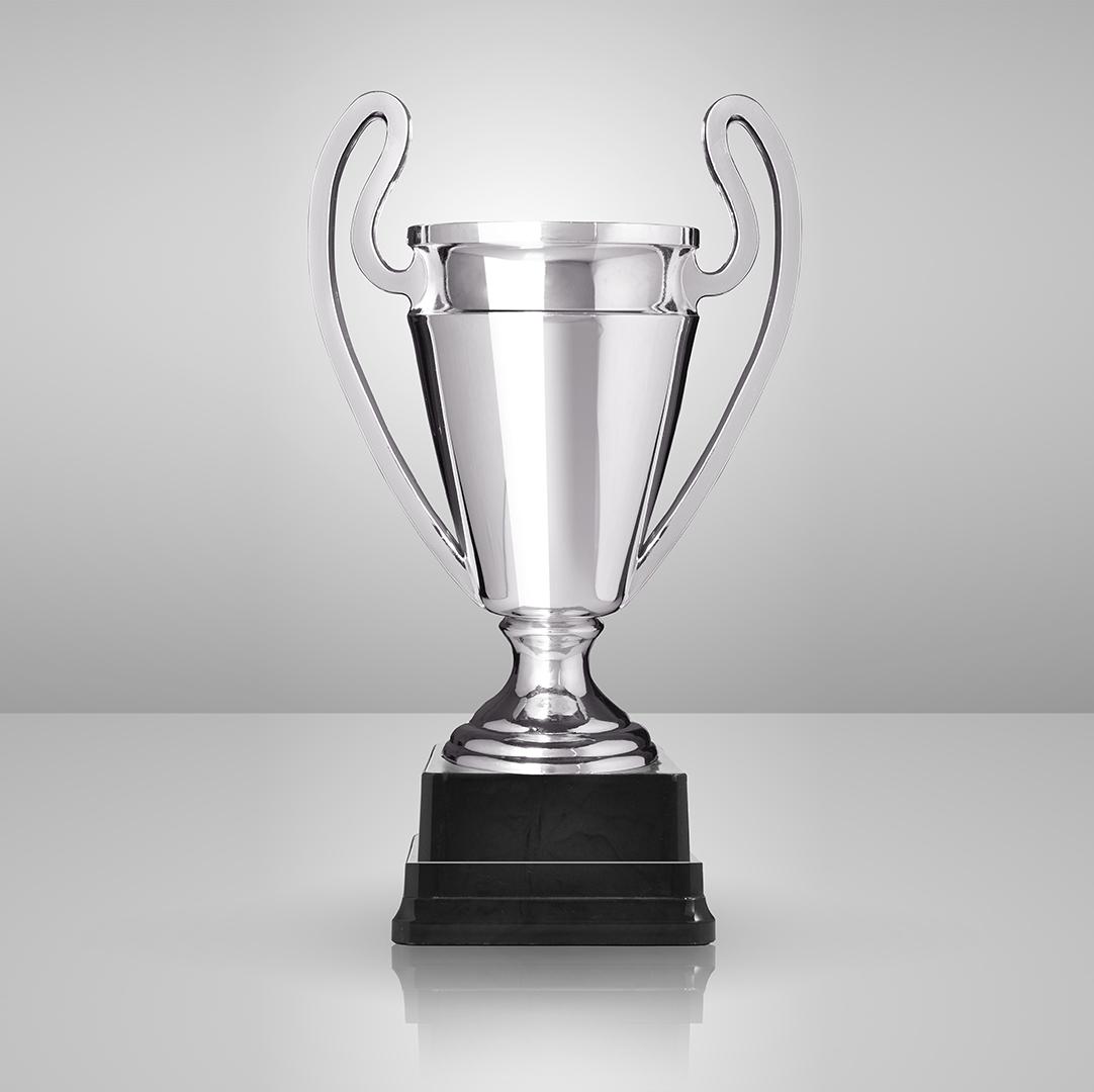 champion silver trophy over grey background